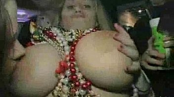 Busty girl shows boobs at Mardi Gras