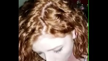 Redhead college neighbor gives an amazing CIM swallow blowjob and flashes a cute smile at the end