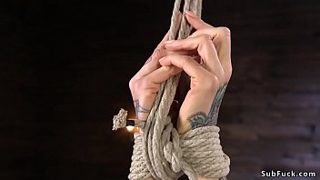 Busty blonde Milf laid in hogtie and whipped by master in dungeon