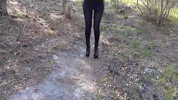 Laura on Heels model step sister in a difficult walk in the forest, wearing black platform heels