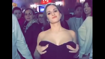 Cute busty girl in dress flashes boobs